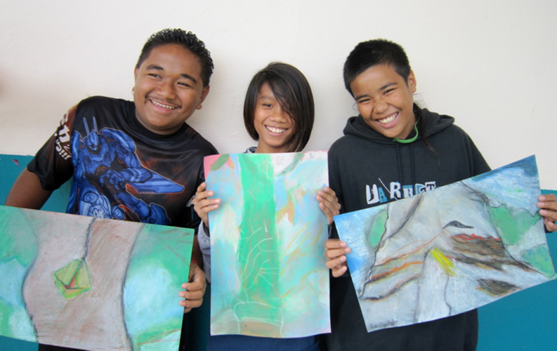 Proud middle school students sharing their visual metaphors of change. (Honolulu HI)